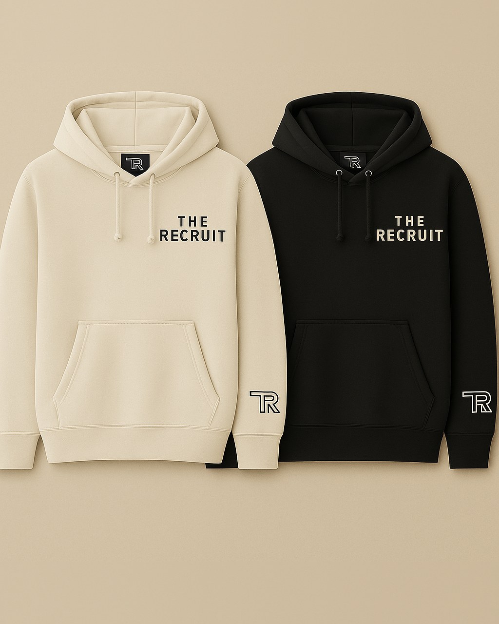Two hoodies side by side, one cream and one black, each printed with The Recruit across the chest and the TR logo on the sleeve cuff